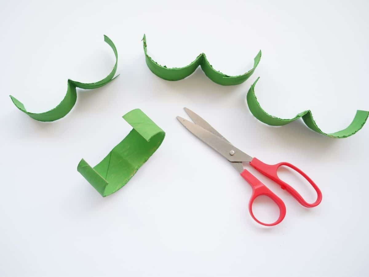 toilet roll slices cut in half and folded with scissors