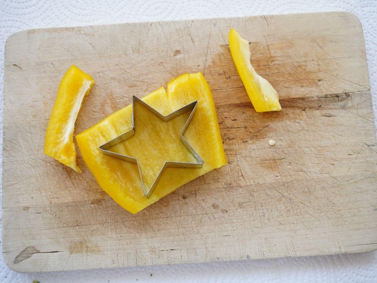 yellow pepper cut into star and garland for veggie christmas tree platter