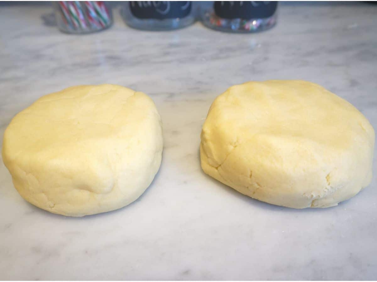 christmas sugar cookie dough in two balls ready to chill