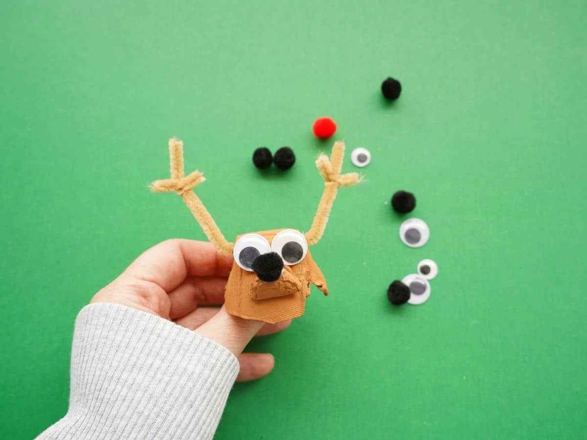 egg carton reindeer with googly eyes and pompom nose glued on