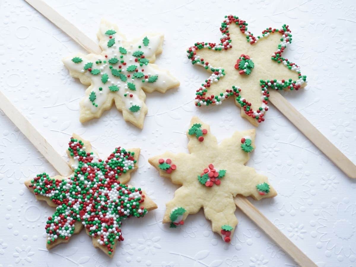 snowflake christmas cookie on a stick decorated