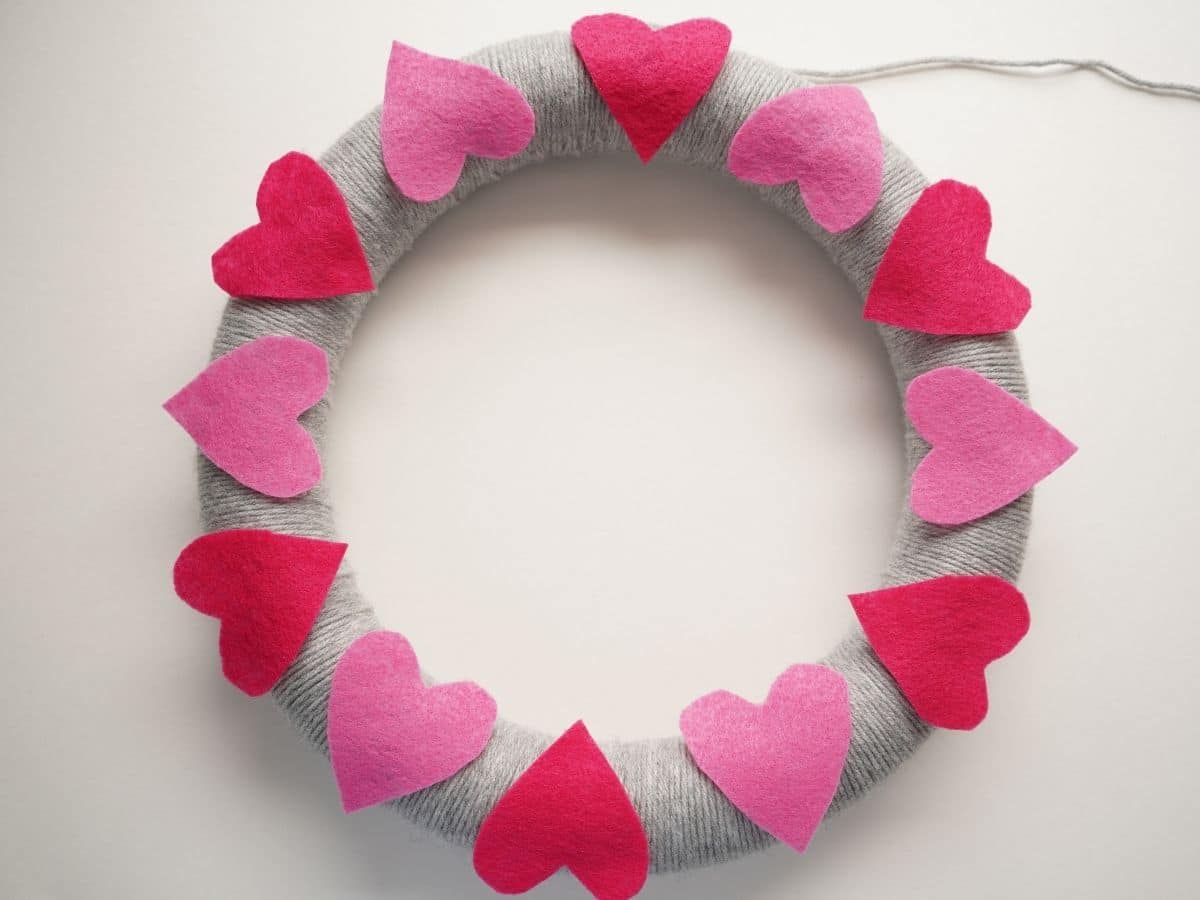 pink felt hearts glued on to grey yarn wrapped wreath