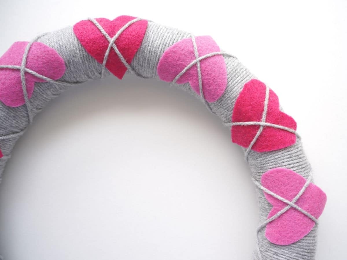 pink felt hearts wrapped argyle style with grey yarn