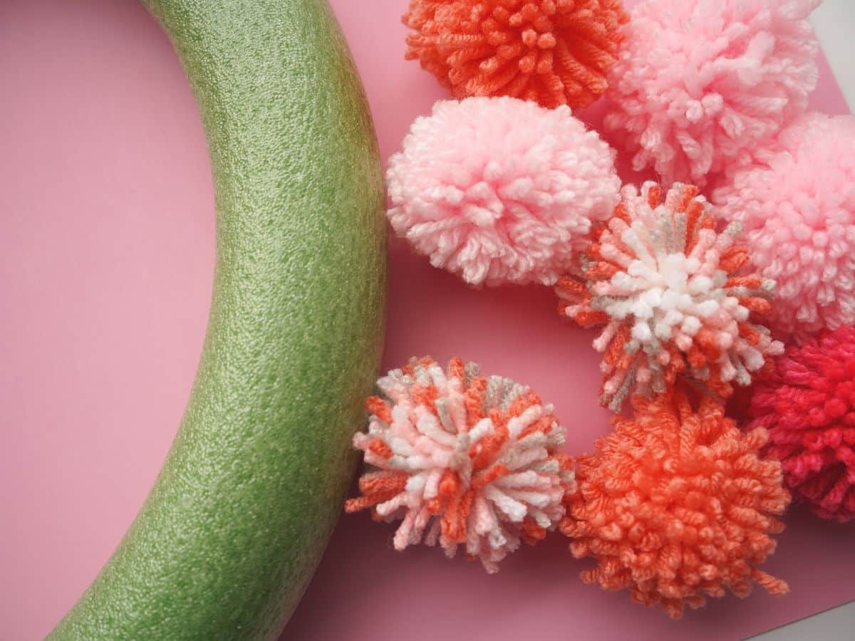 pink pom pom and foam wreath form