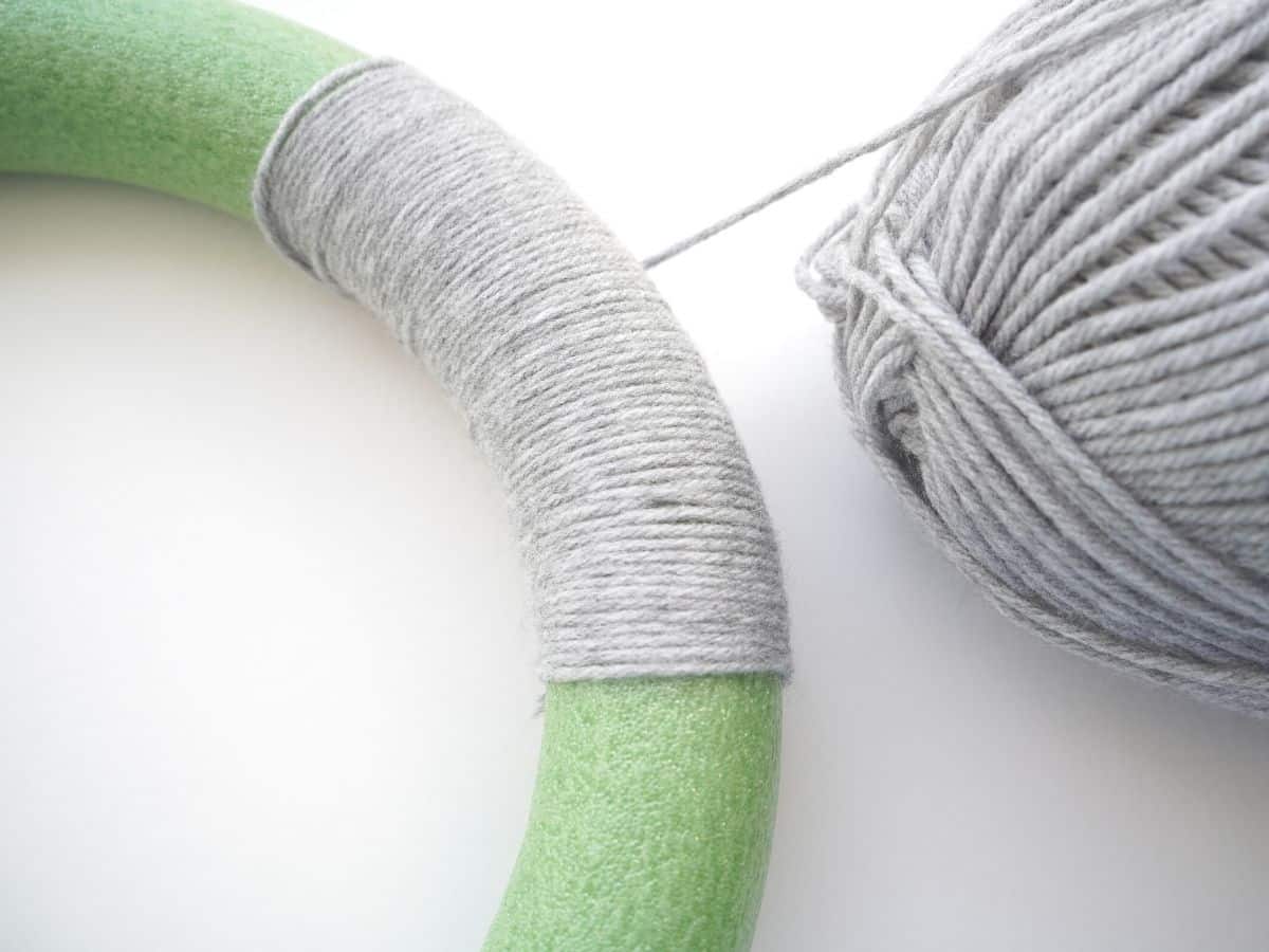 wreath form wrapped in grey yarn