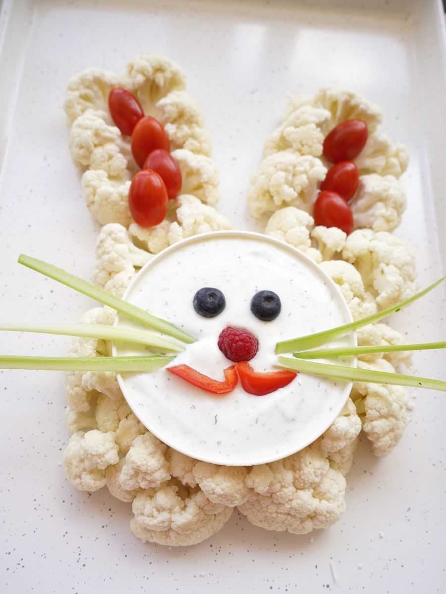 easter bunny cauliflower heard with vegetable dip face on platter