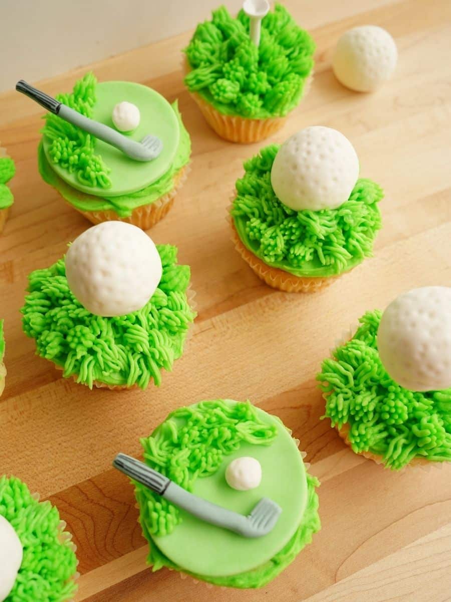father's day golf themed cupcakes on wood cutting board