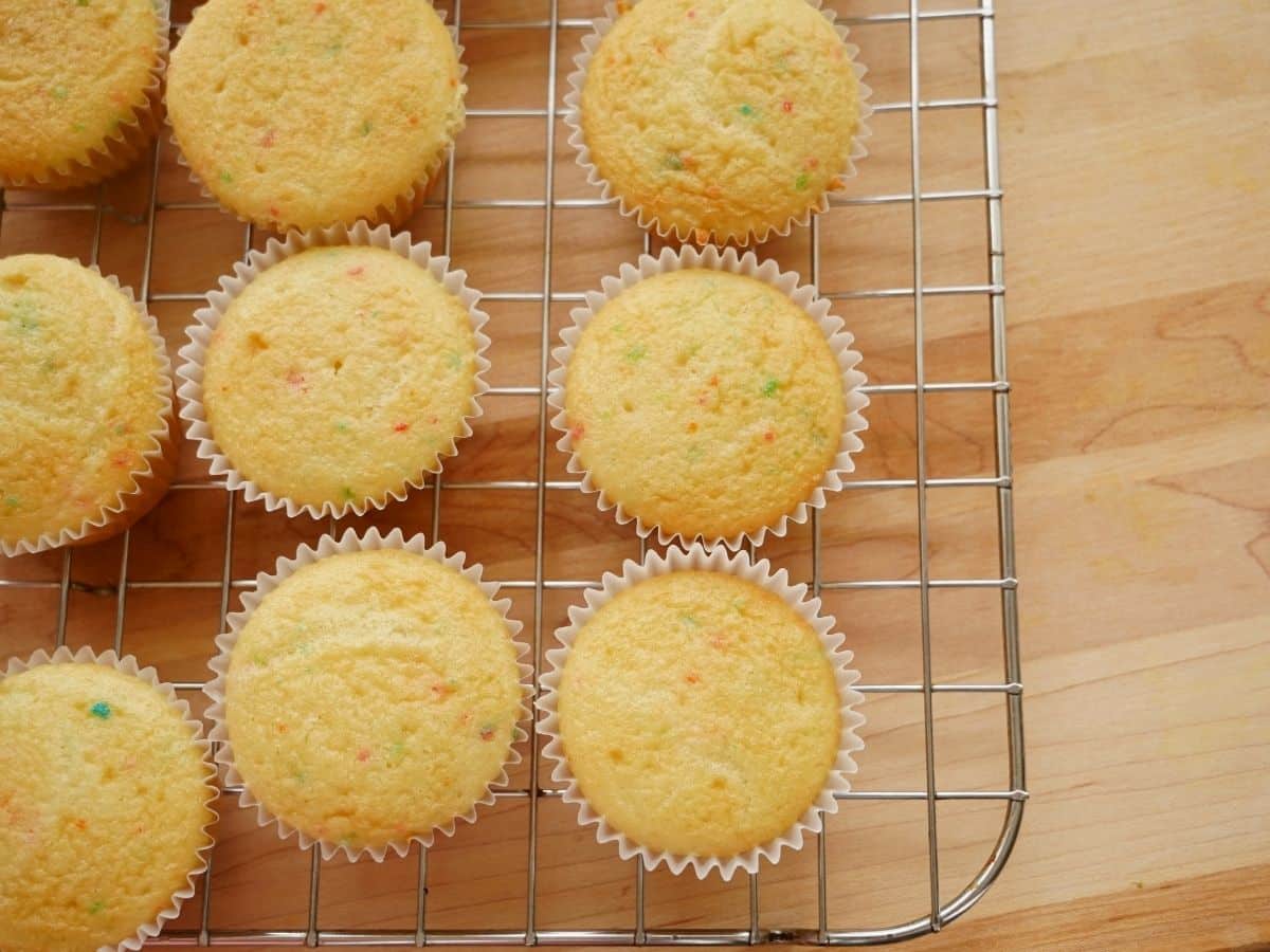 funfetti cupcakes baked and cooling on rack