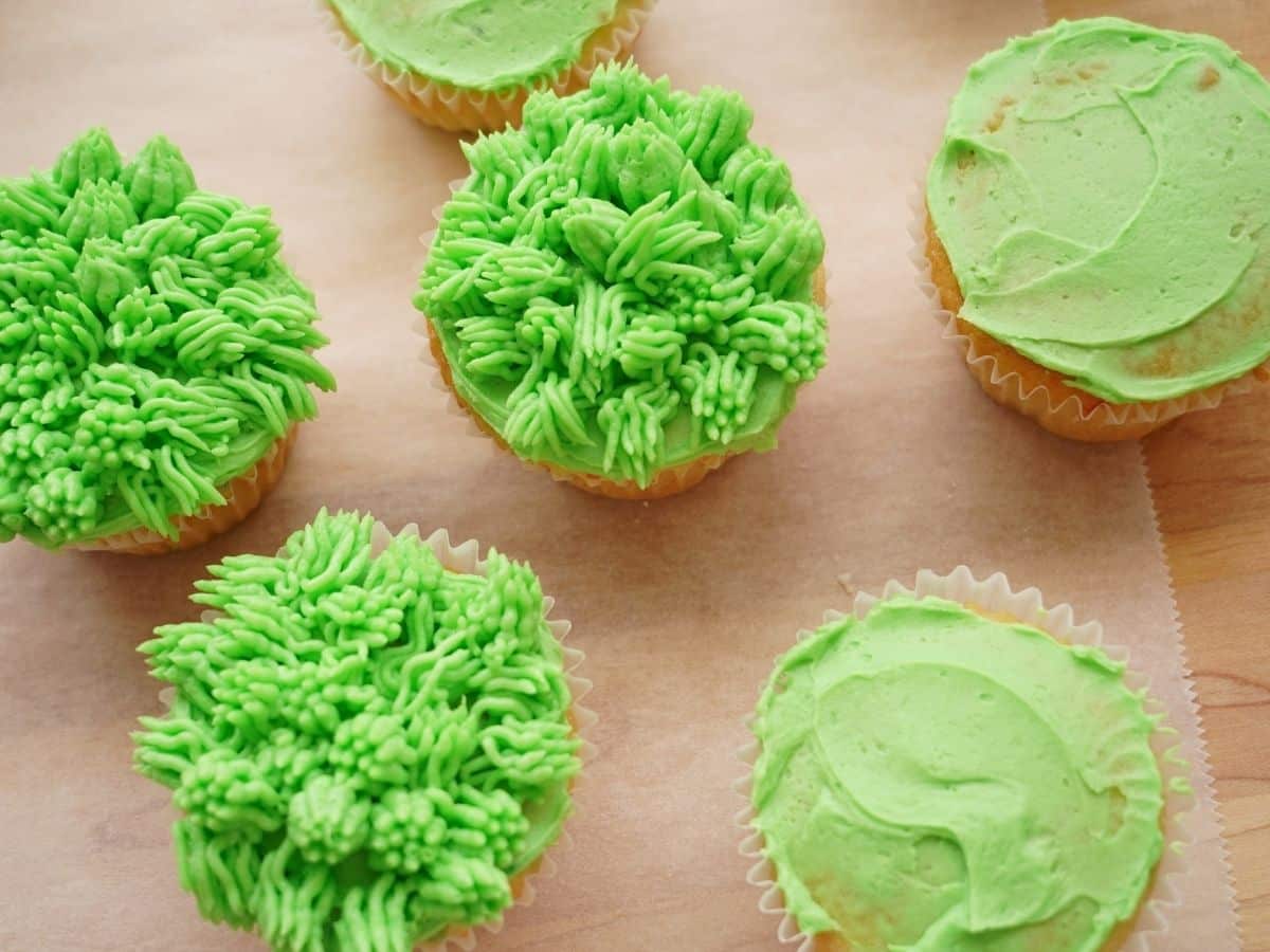 grassy green buttercream icing on cupcakes and cupcakes with smooth green icing