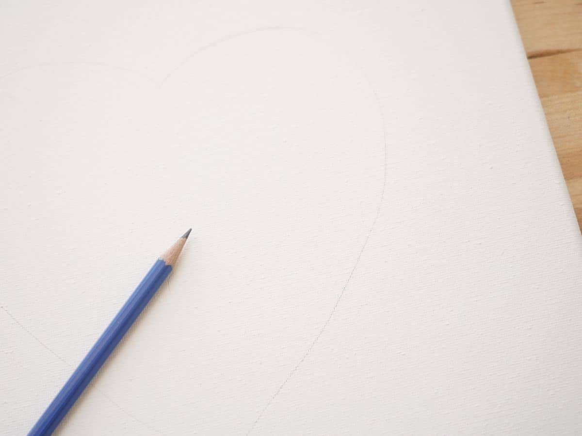 heart sketched on canvas with pencil
