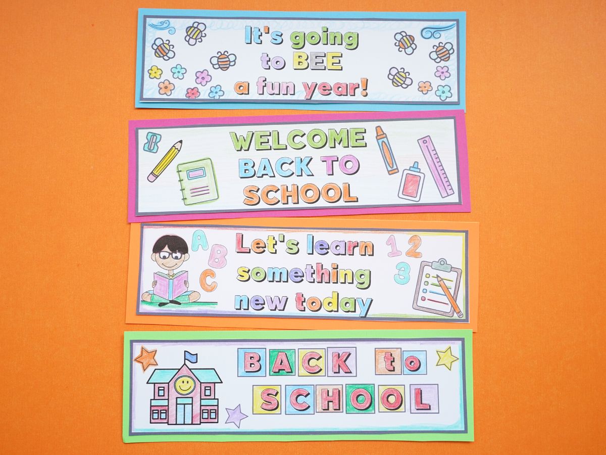 4 back to school bookmarks for kids printed and coloured on an orange background