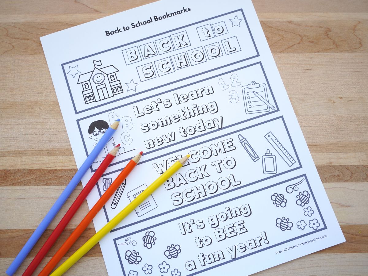 print out of back to school bookmarks on table with pencil crayons