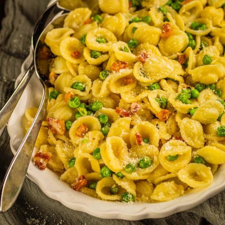 plate of pancetta orchetti pasta with peas