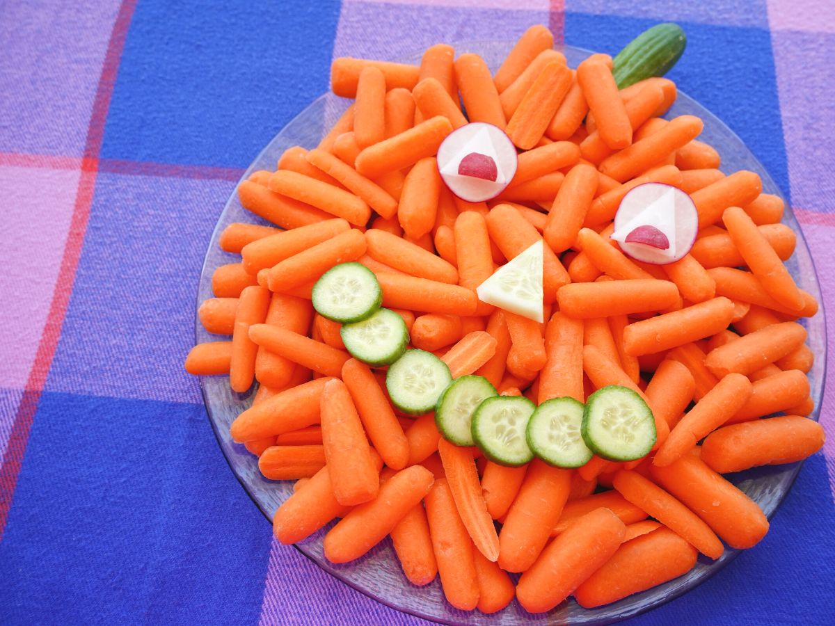 finished pumpkin veggie tray on plaid table cloth