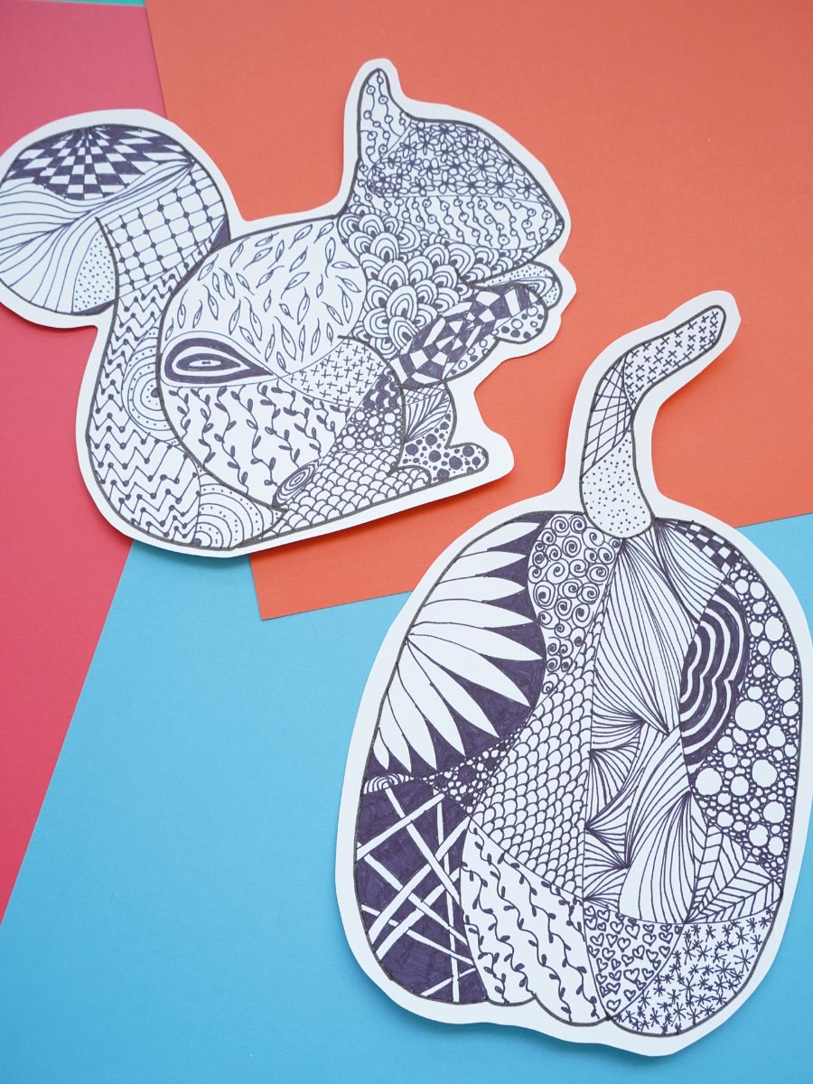 fall zentangle designs inside pumpkin and squirrel designs on a fall background