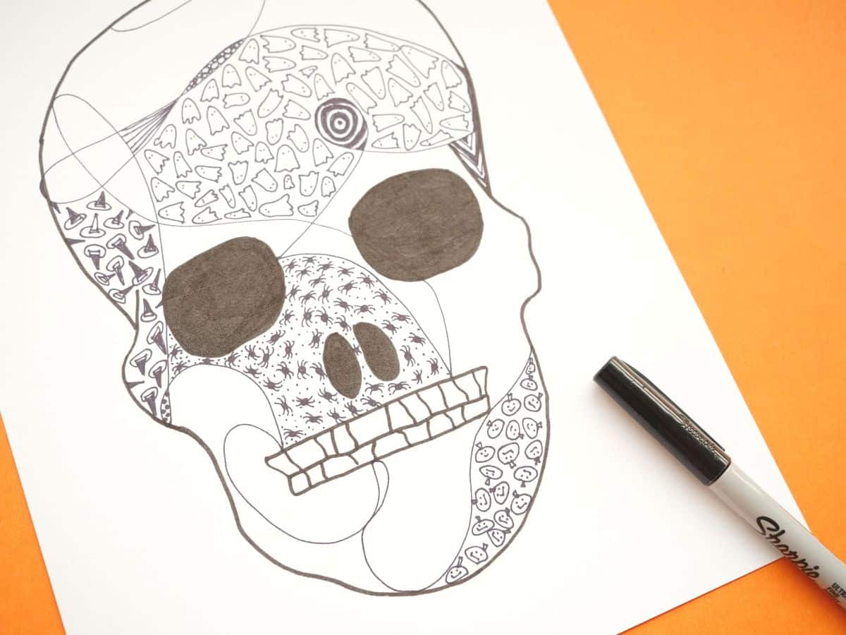 halloween skull filled with halloween zentangle designs ghosts, witch hats and spiders and jack o'lanterns