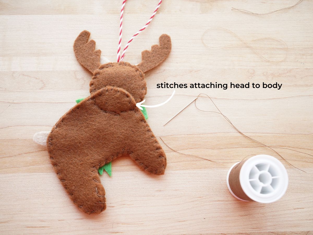back of diy felt reindeer ornament showing how the head is sewn to the body