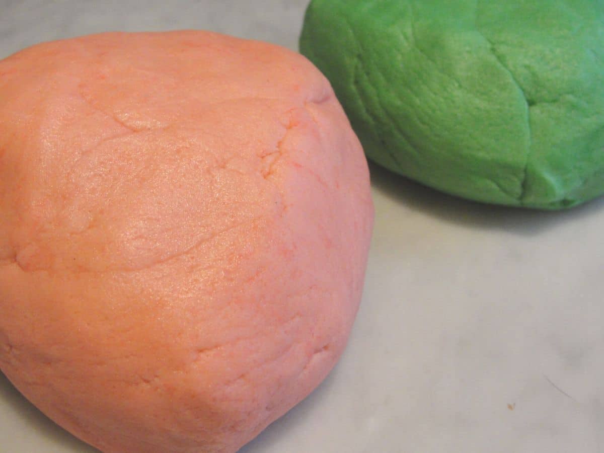 balls of pink and green sugar cookie christmas dough