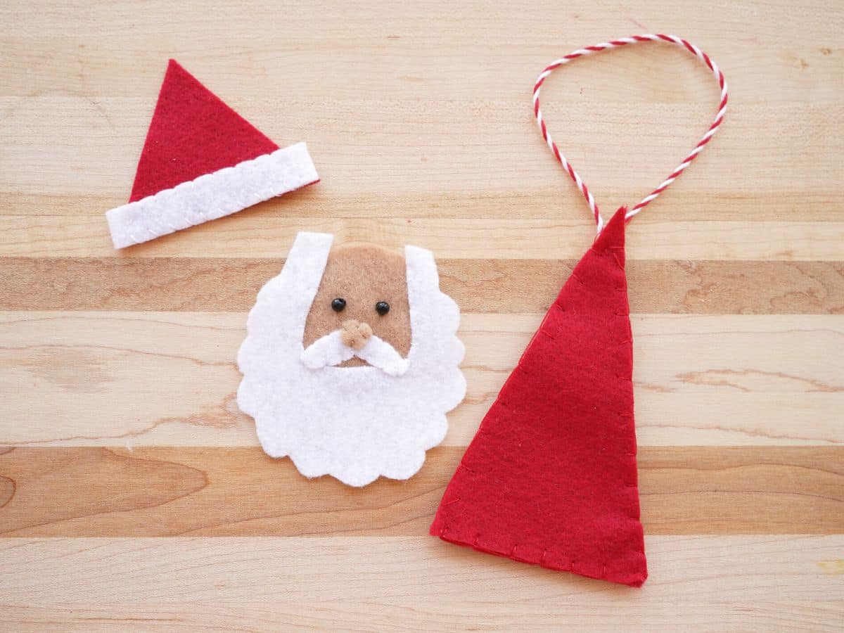 felt santa hat with trim, felt santa face and felt santa body