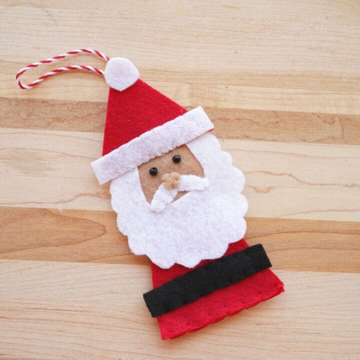 felt santa ornament finished on wood tabletop