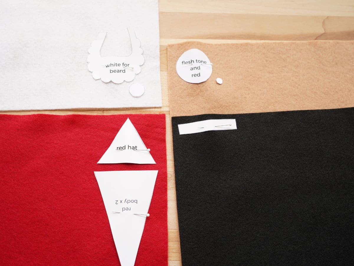 felt santa pattern pieces pinned to felt