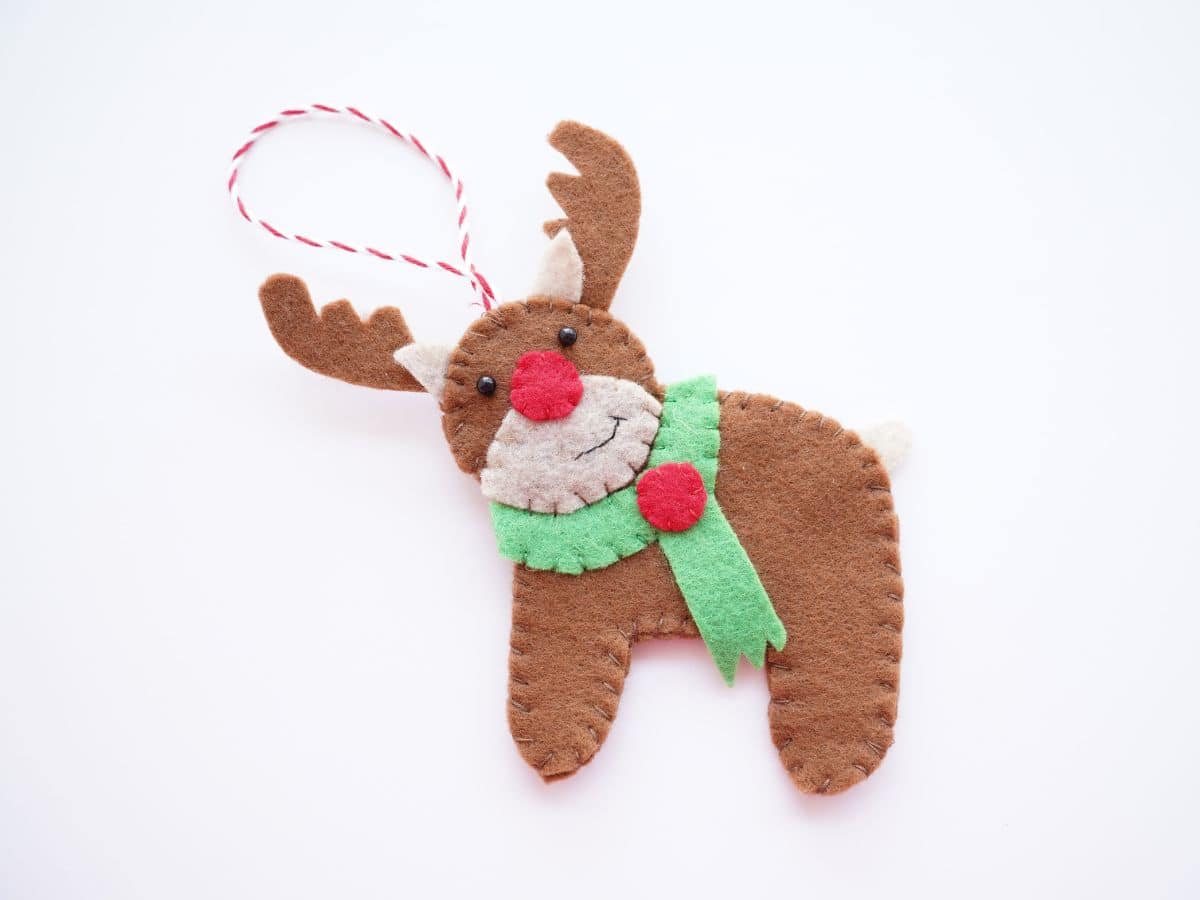 finished handmade felt reindeer ornament on white background