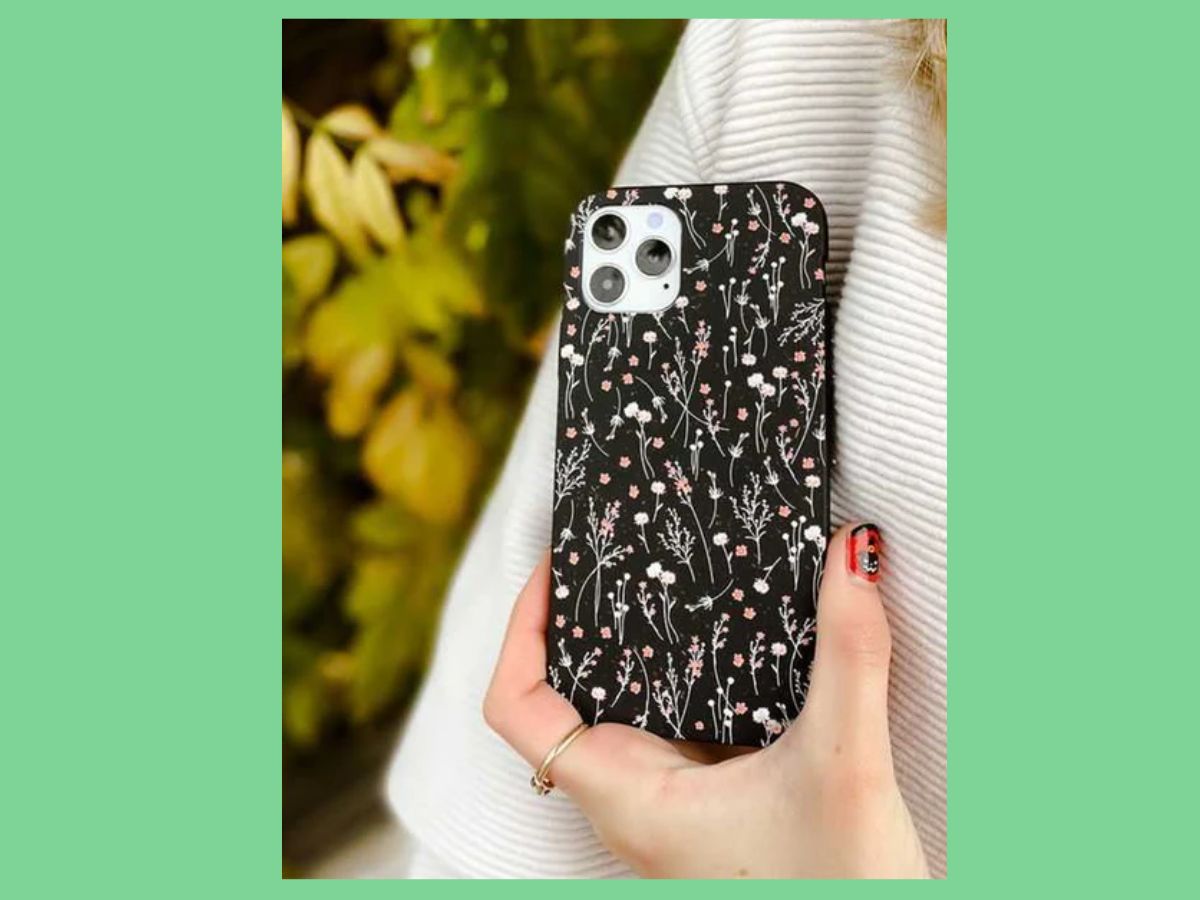phone case night garden held in woman's hand