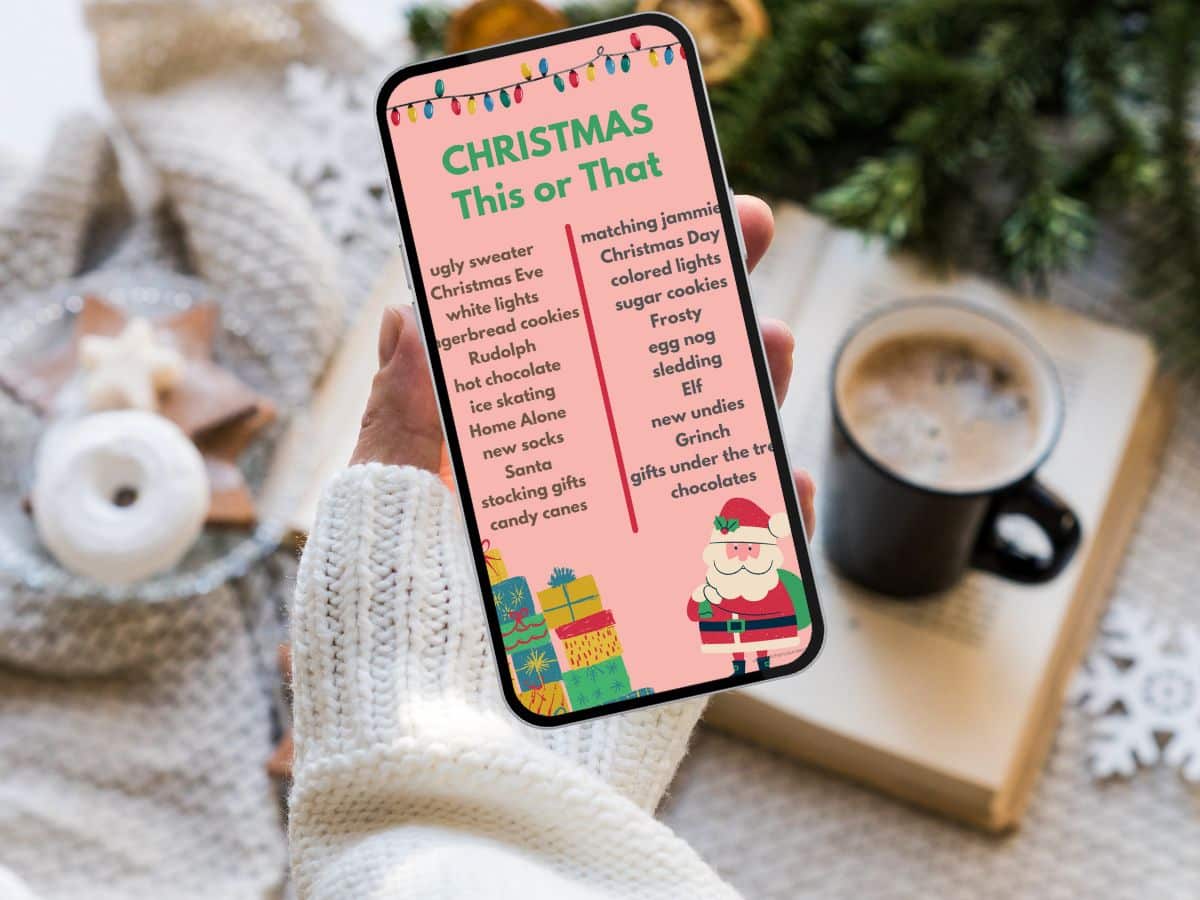Christmas this or that questions instagram template on iphone in woman's hand with coffee in the background