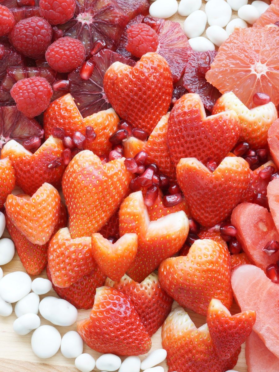 close up of valentine fruit tray strawberries and yogurt covered raisins