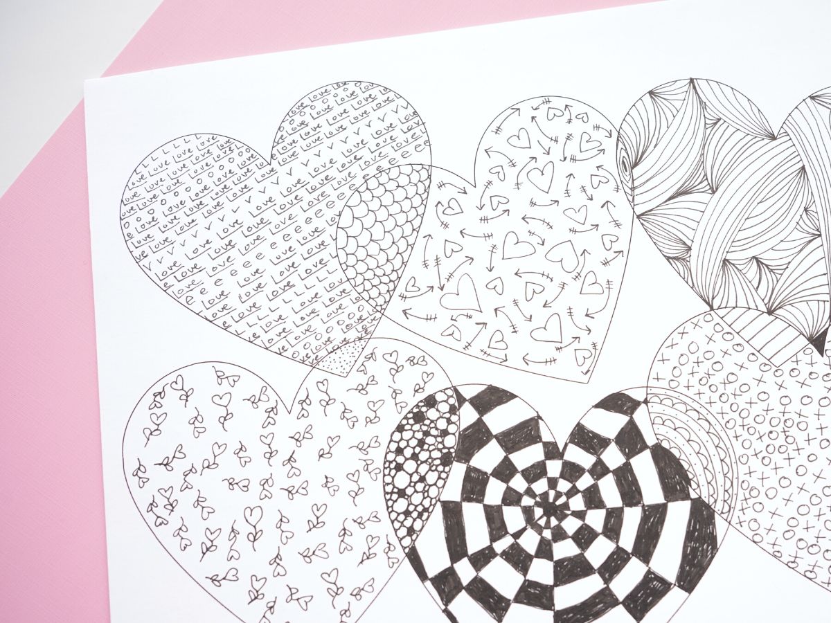 love zentangle pattern inside overlapping hearts surrounded by other heart patterns