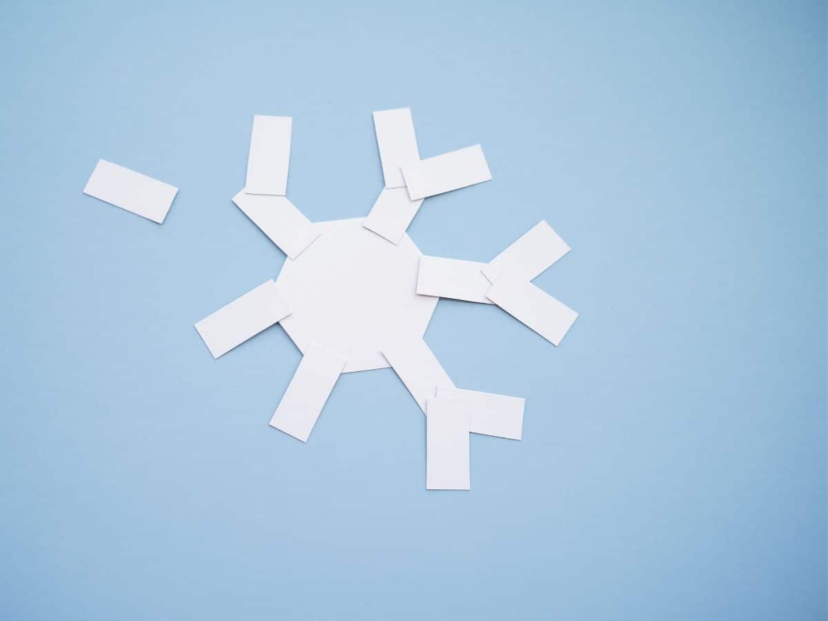 paper snowflake with second layer of snow particles