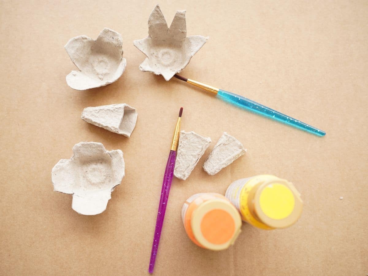 egg carton flowers cut out with paint brushes and paints