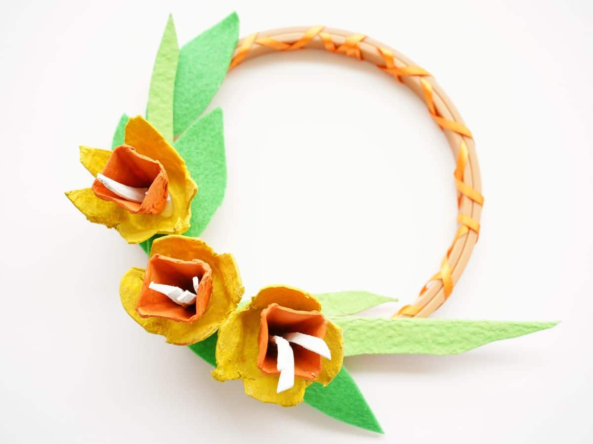 final egg carton flower daffodil wreath on white background