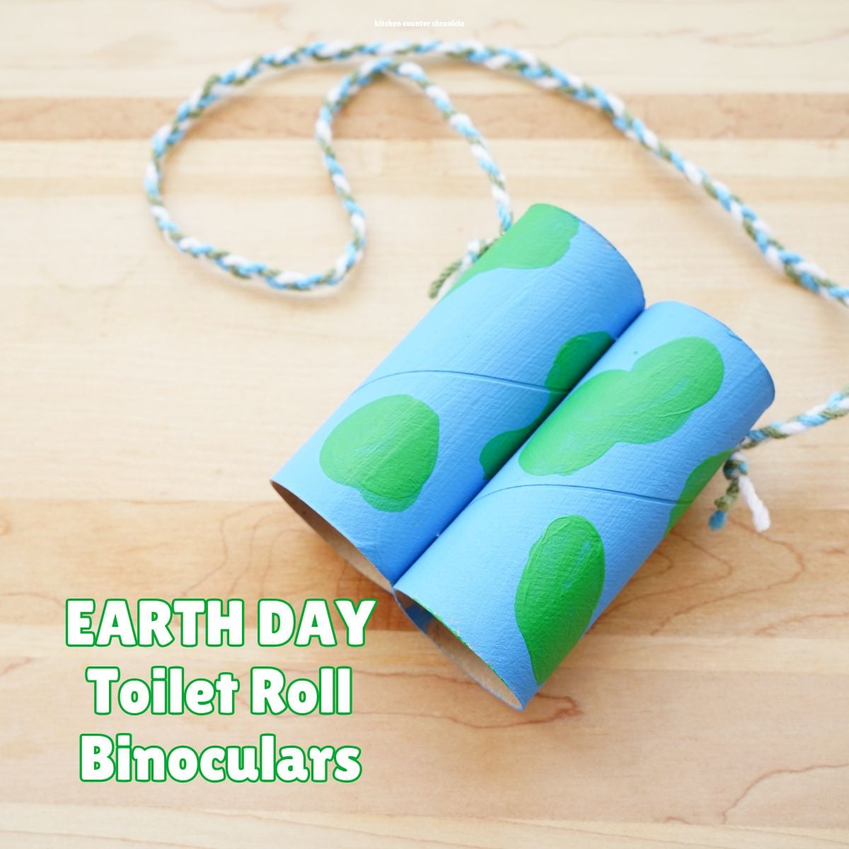 close up of toilet paper roll binoculars that are painted for an Earth Day craft