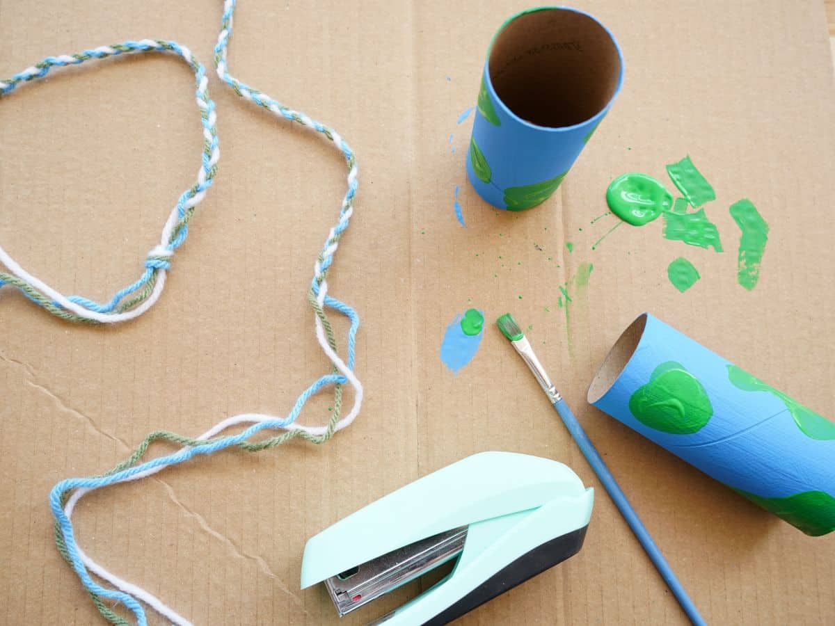 painted toilet paper rolls with braided yarn and stapler of toilet paper roll binoculars