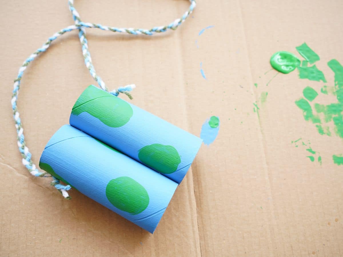 paper roll binoculars with yarn strap stapled on