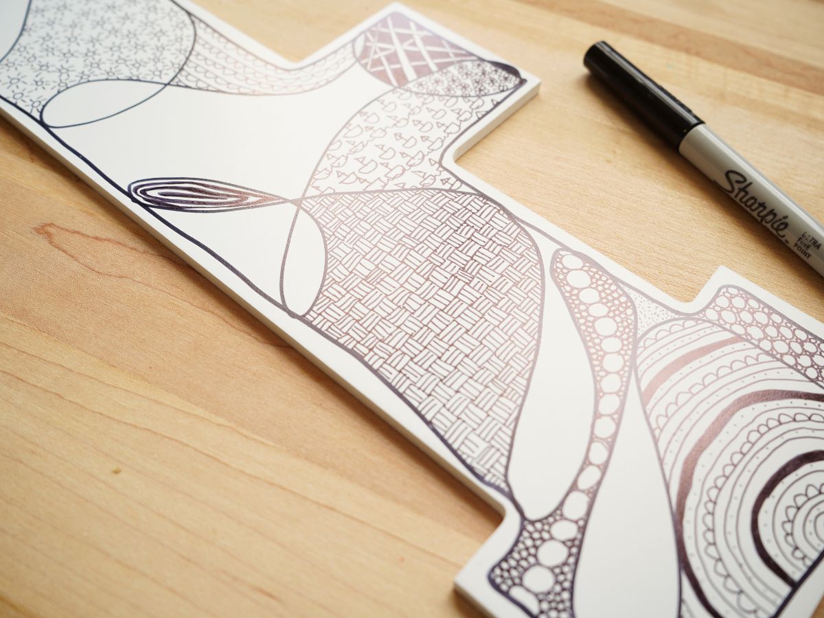 close up of zentangle patterns on wall hanging art piece
