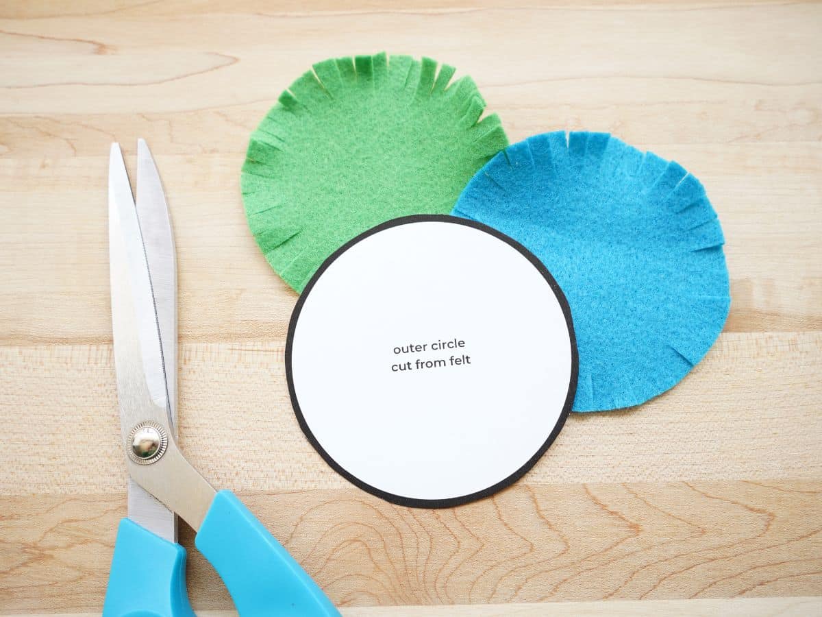 green and blue circles of felt cut out for fathers day medal craft