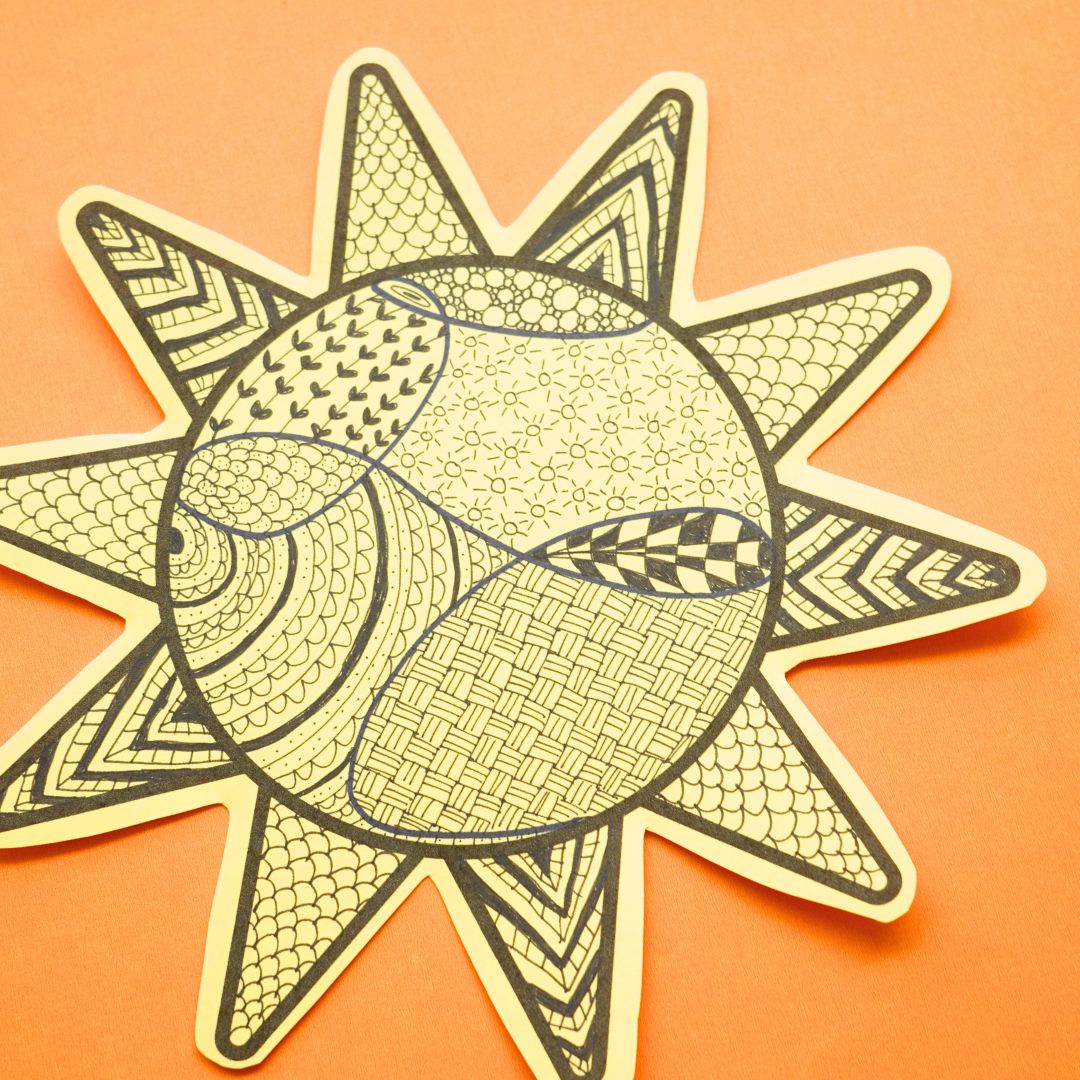 instagram sun zentangle cut out on yellow paper
