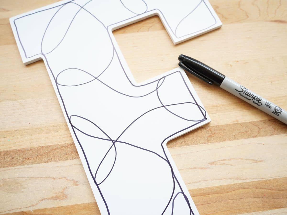 zentangle tangle drawn on f initial with marker