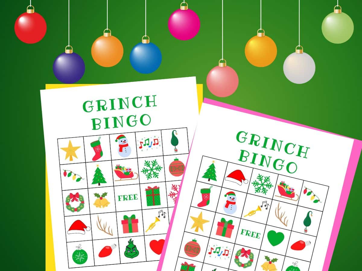 2 grinch bingo cards on a green background with a row of ornaments on top