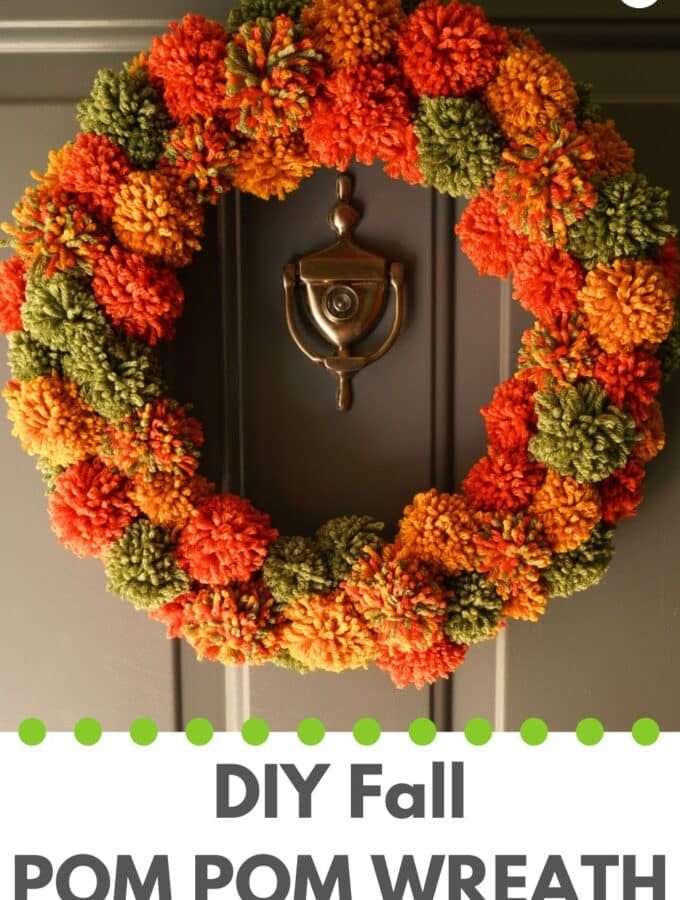 title "DIY fall pom pom wreath" with fall pompom wreath hanging on front door.