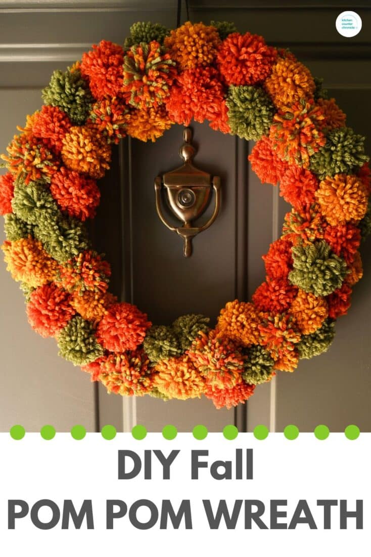 title "DIY fall pom pom wreath" with fall pompom wreath hanging on front door.