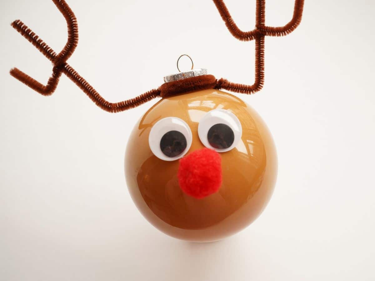 Rudolph ornament ball with antlers, googly eyes and Rudolph nose glued on