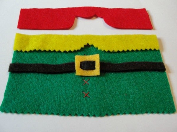 elf outfit cut out of felt pieces and layed on table