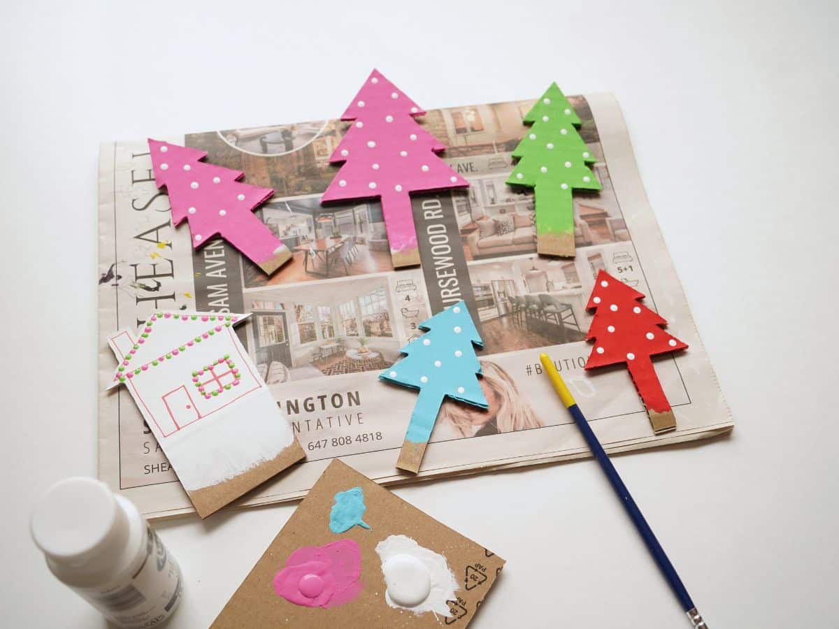 little cardboard trees painted with color and little white polka dot lights