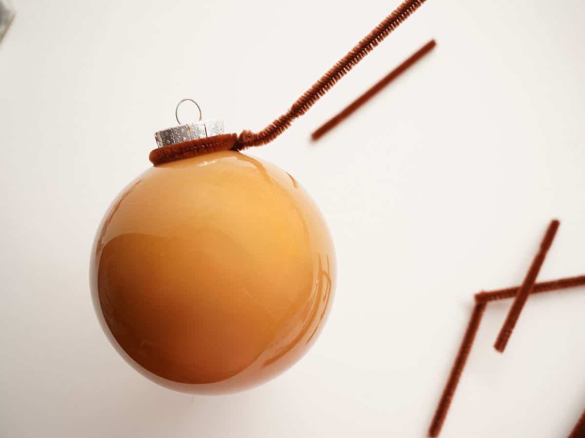 reindeer ornament with pipe cleaner wrapped around the top