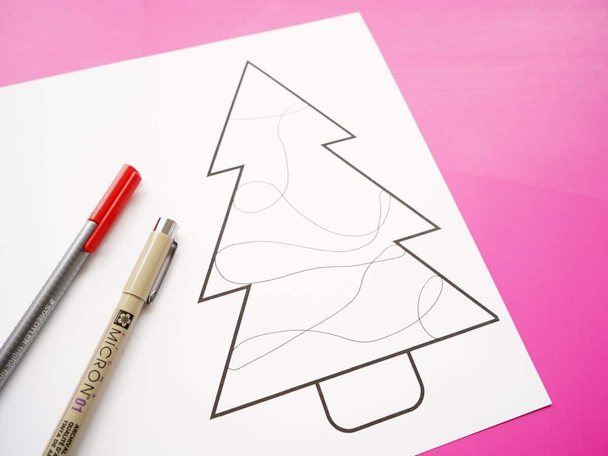 zentangle christmas tree card with first doodle line drawn inside blank tree
