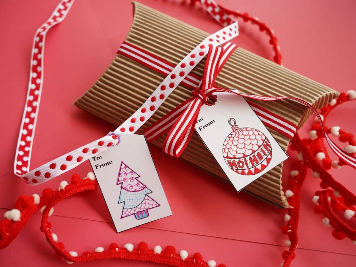 zentangle gift tags tied on presents with red ribbons