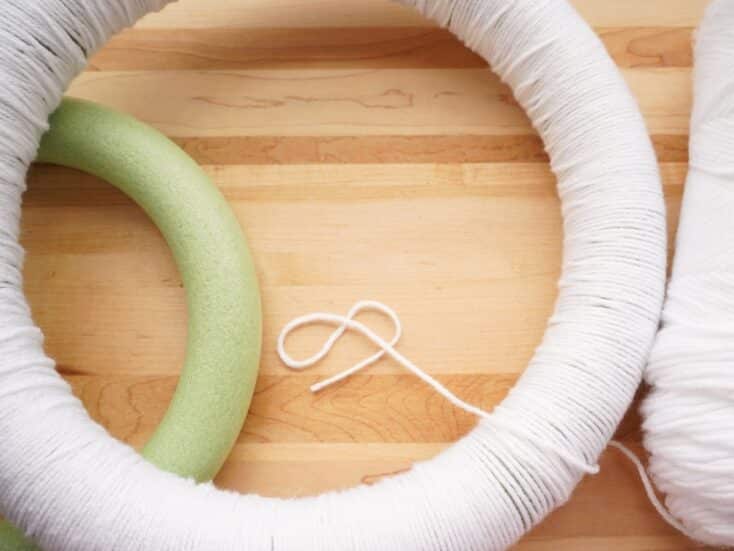 foam wreath form wrapped with white yarn